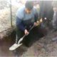 Athar's father while digging grave for his son.