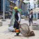 An employee of muncipal council holding a net to trap dogs stands deployed at newly renovated Polo View market as G20 delegates are likely to visit the area on May 24, 2023. [FPK Photo/ Umar Farooq]