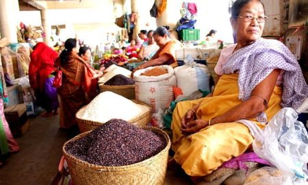 An Eema selling glutinous rice at Eema Bazaar. Glutinous rice is used in Manipur for preparing various dishes such as kheer, sweetdishes, changlhah etc. Location - Eema Bazaar, Imphal, Manipur. (Eema - Mother, Eema Bazaar - a bazaar in Imphal "manned" exclusively by women.)