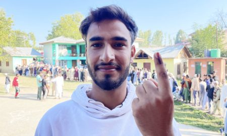 A woman displays ink on her finger after casting her vote in Pulwama, Kashmir on September 18, 2024. [FPK Photo/ Qayoom Khan]